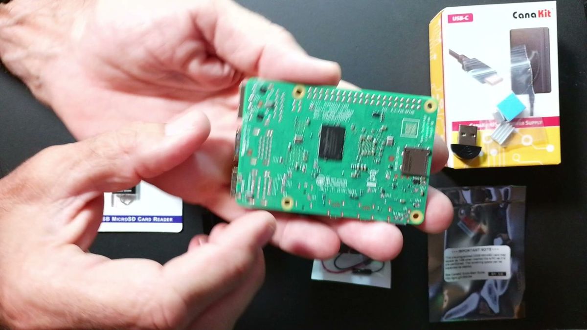 Holding the Raspberry Pi 4 board
