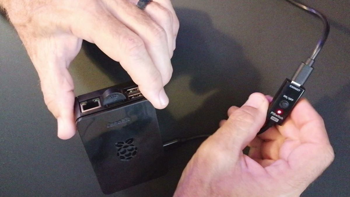 Plugging the USB mic into the Pi