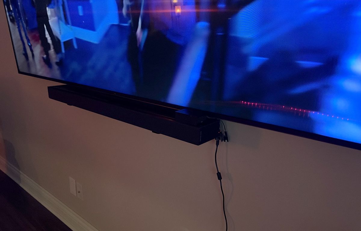 The Movie Leveler installed under the TV, its Pi box at the right end of the soundbar